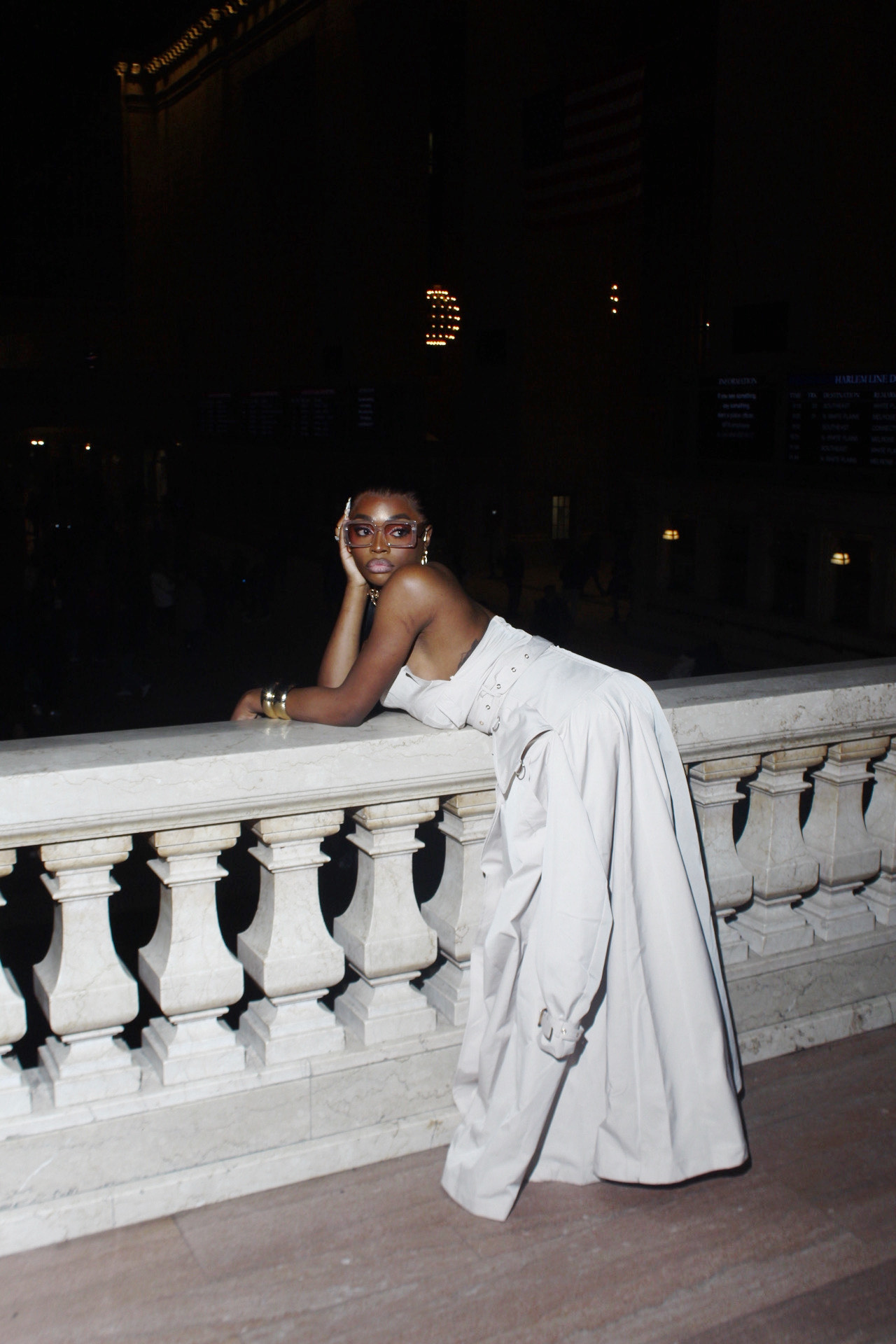 Kimberly Jones at night on a grand balcony.